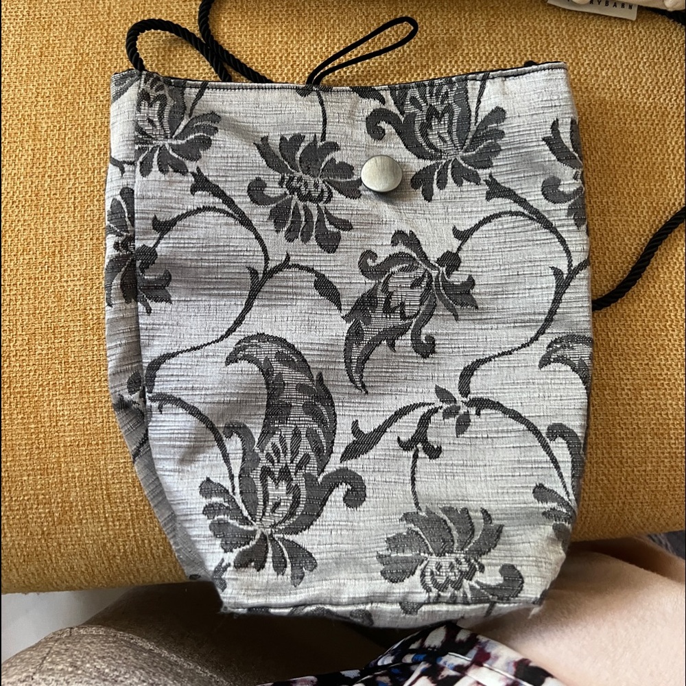 Soft silky (inside) and out. Grey and black bag